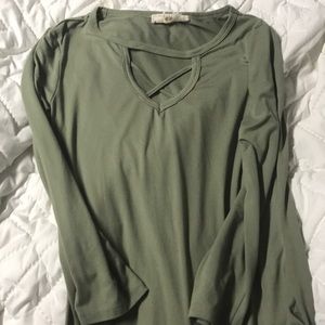 army green body suit with cross detail